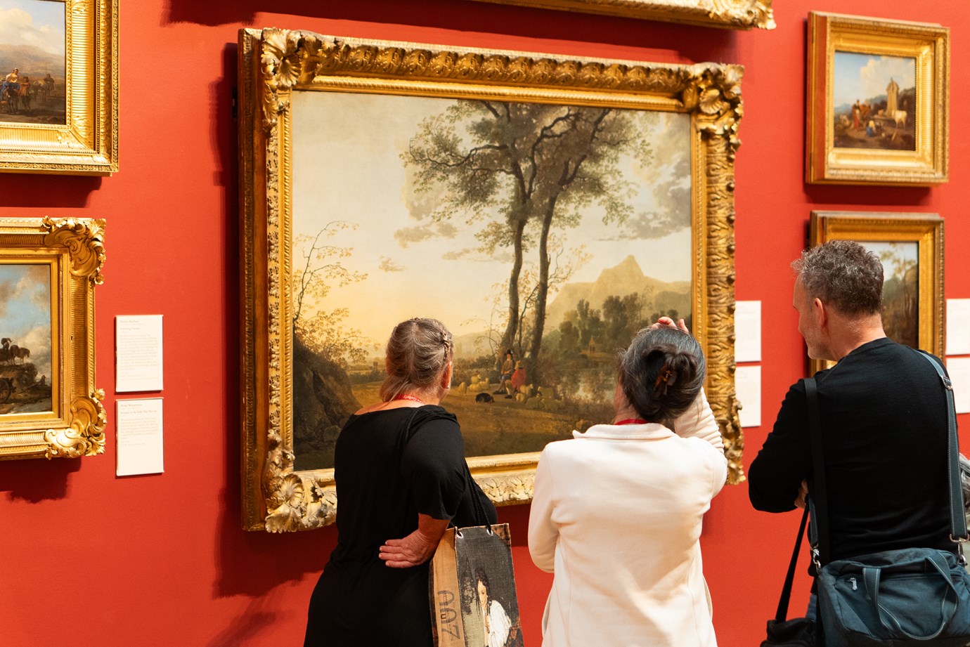 Visitors admiring a painting inside the Gallery.